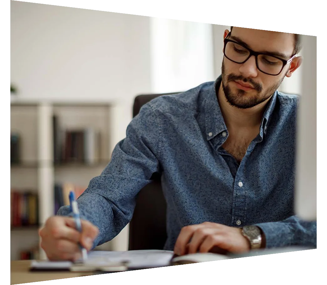 Man writing at desk