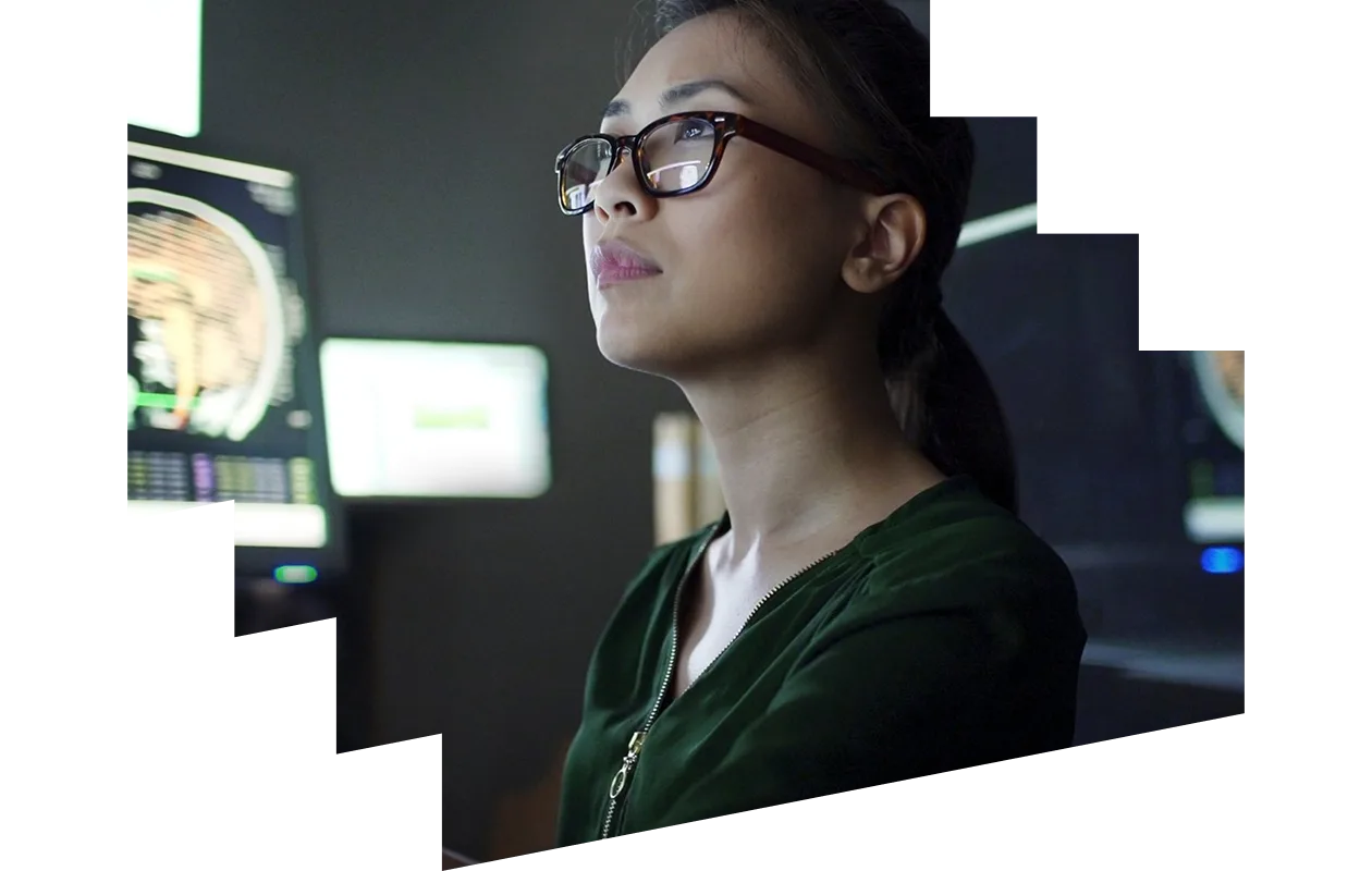 Male clinician looking through microscope