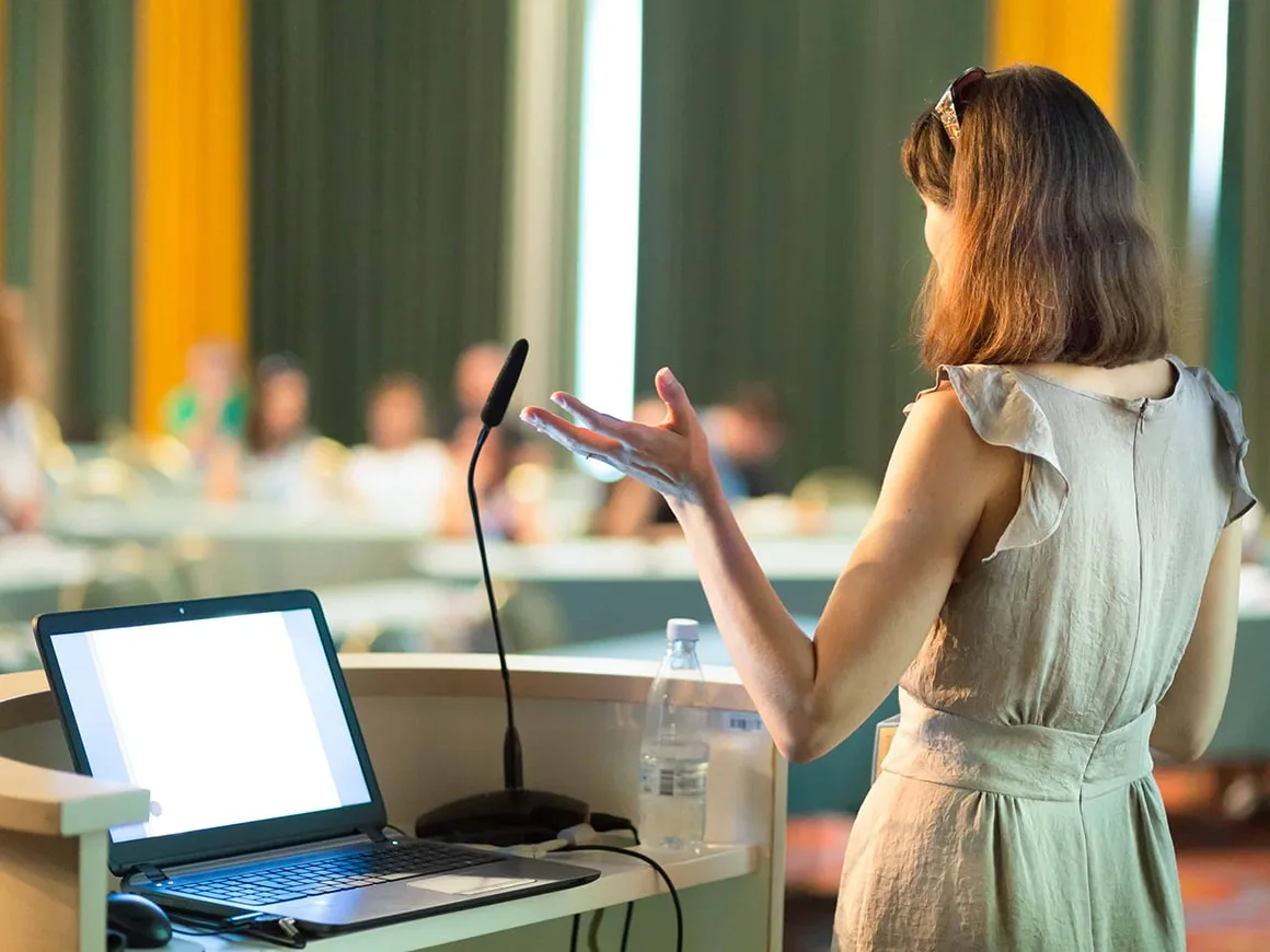 Female speaker at a conference