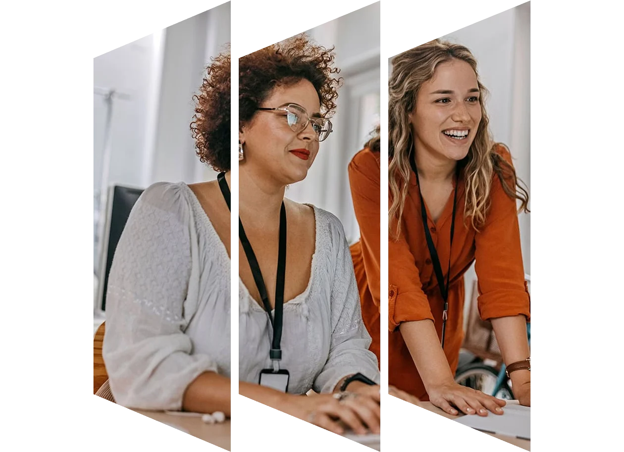 Two businesswomen working together on computer at office