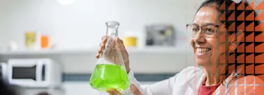 Gender and Diversity in Research, woman smiling and holding scientific flask