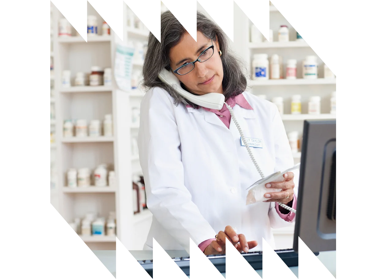 Pharmacist clinic handing medication to patient