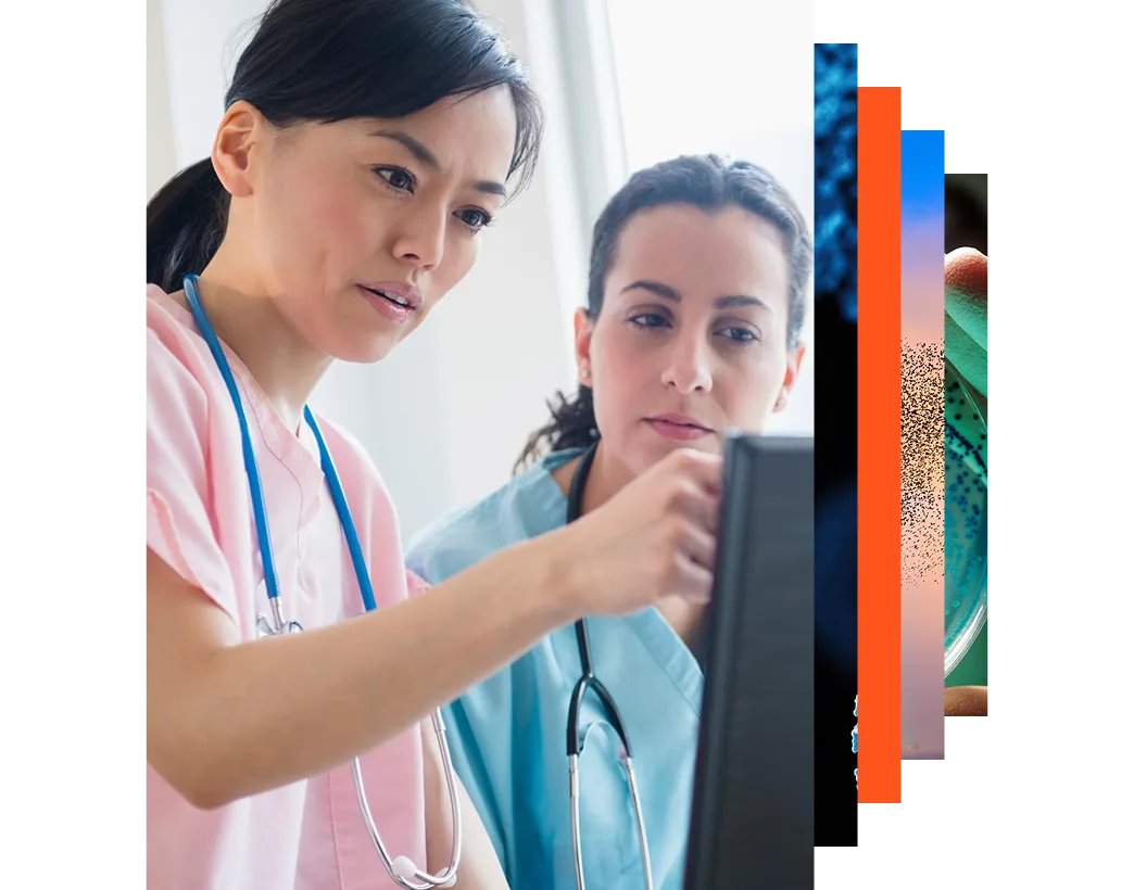 Nurses looking at a computer screen together