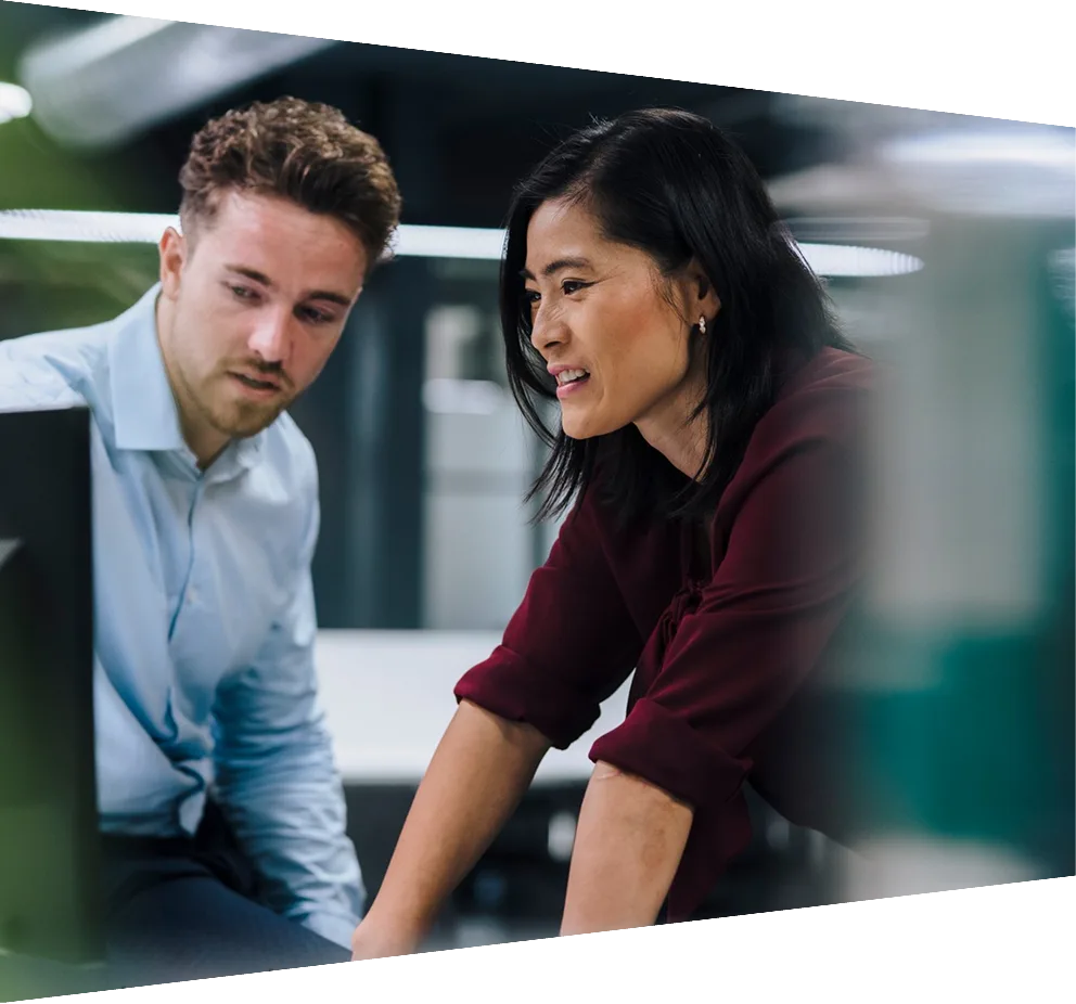 Man and woman looking at computer