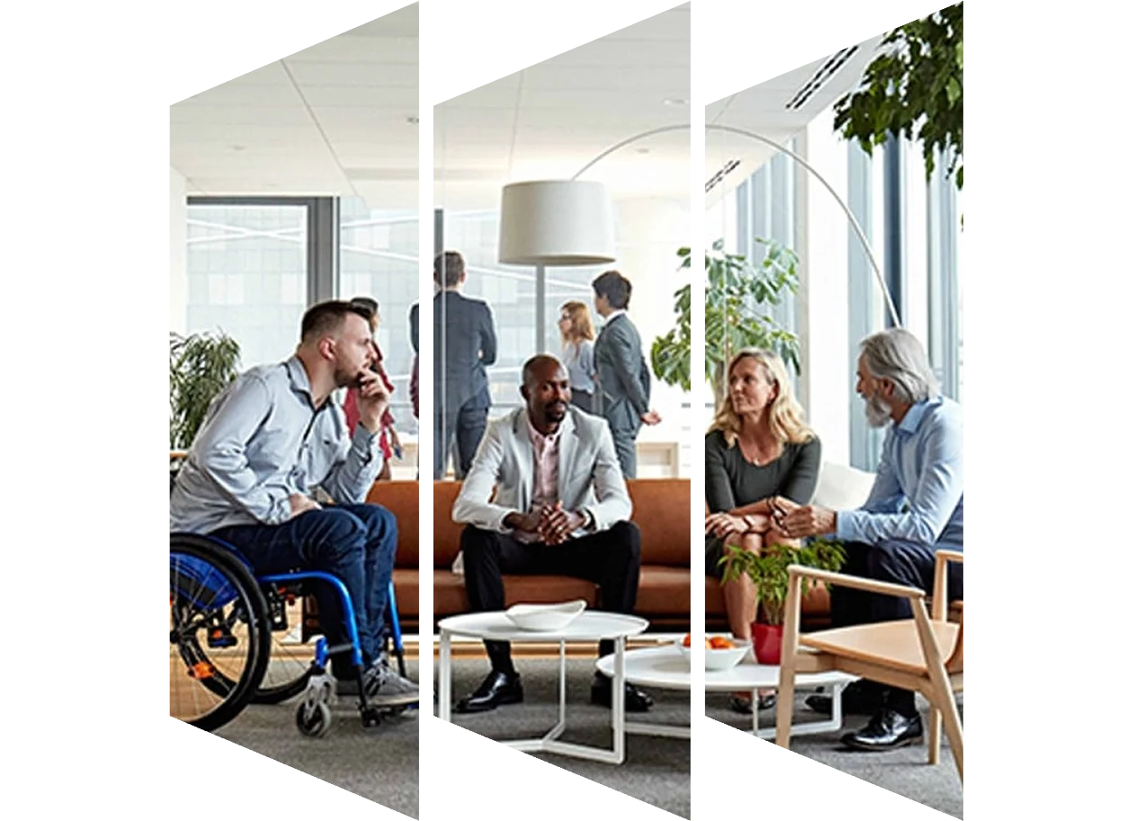A diverse group of individuals sitting in an open area together in discussion