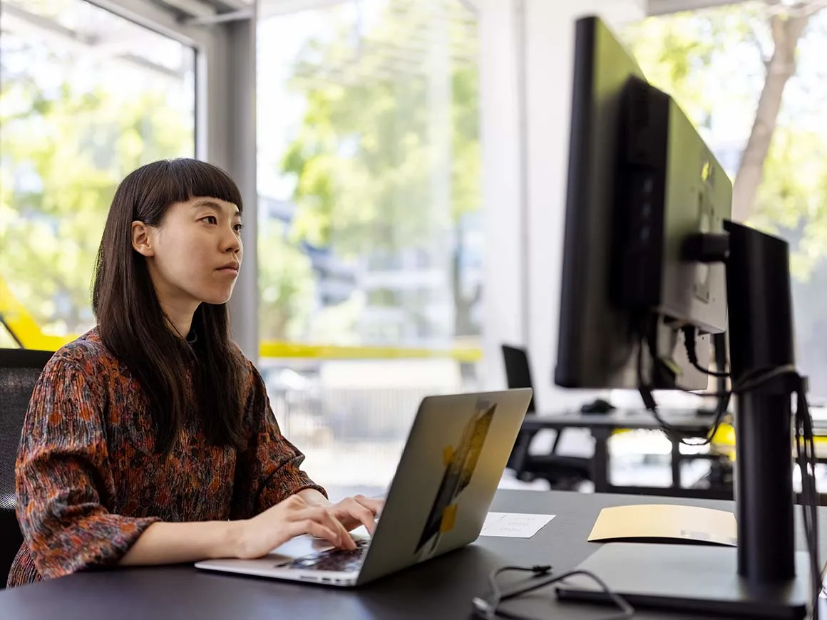 Woman sitting at a computer