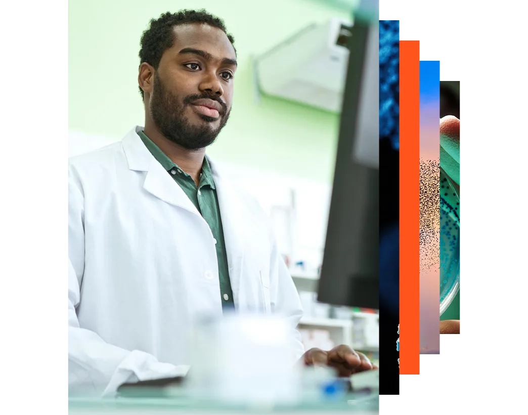Male pharmacist using a computer in a pharmacy