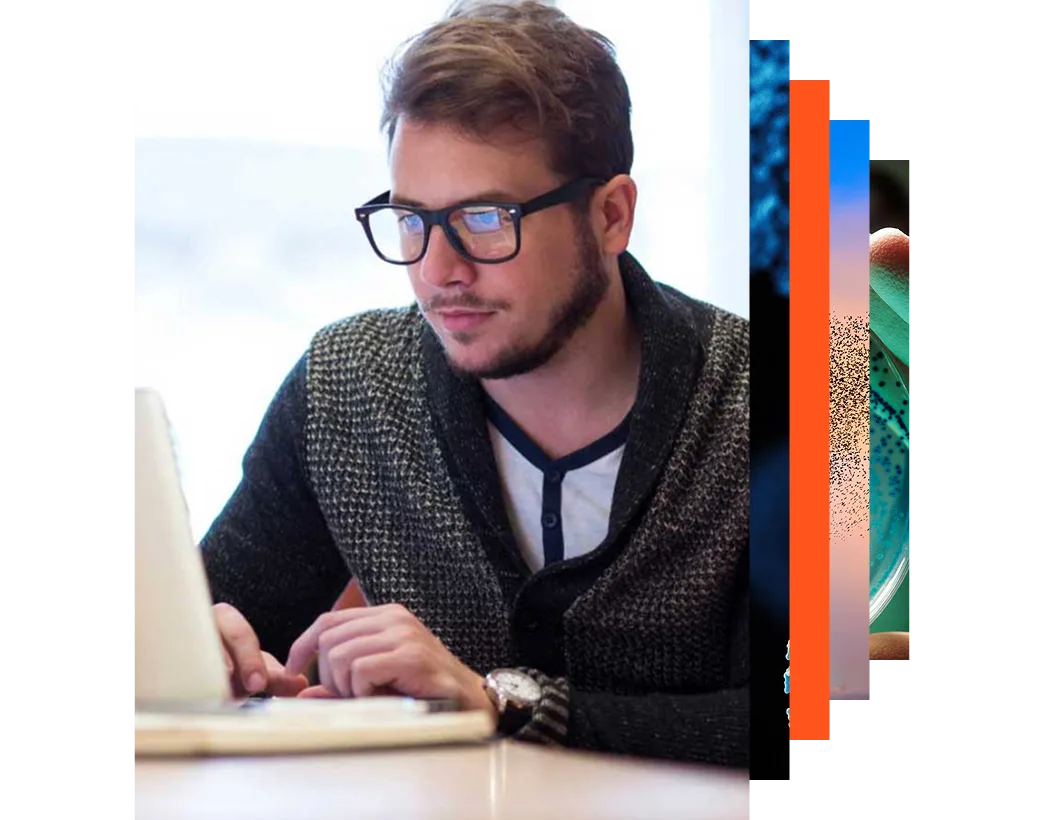 Young male student wearing glasses studying