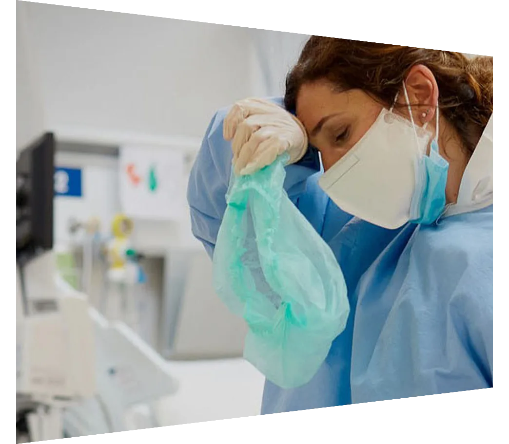 Clinician taking off scrub cap