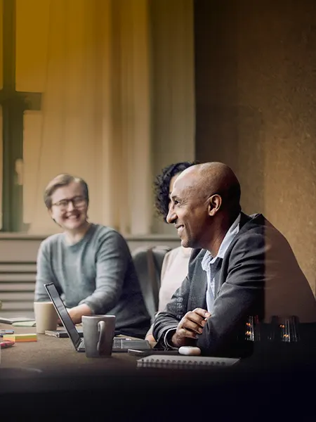 Research leaders sitting together at a table.