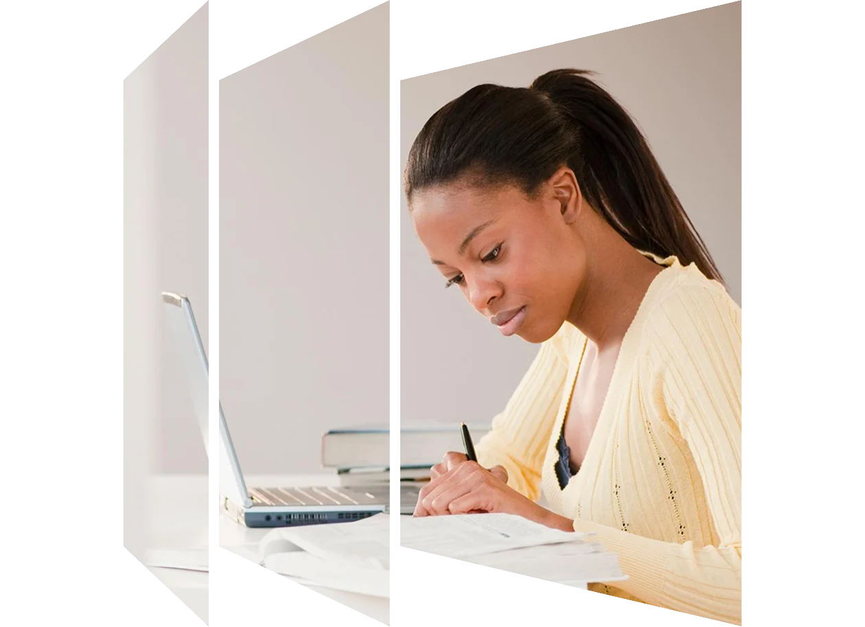 Mixed race woman doing homework with a laptop