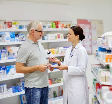 Pharmacist chatting with customer