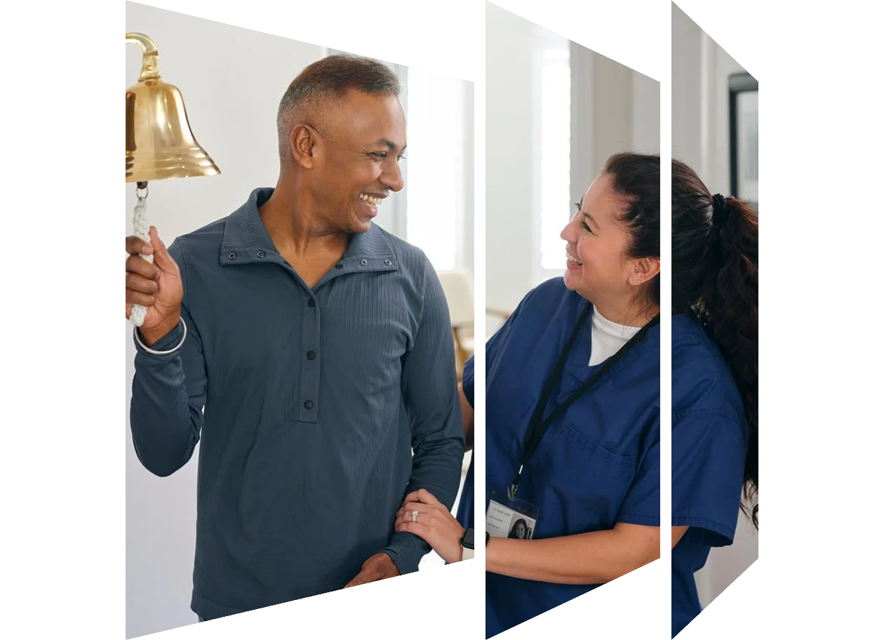 Male nurse pushing smiling senior woman in wheelchair