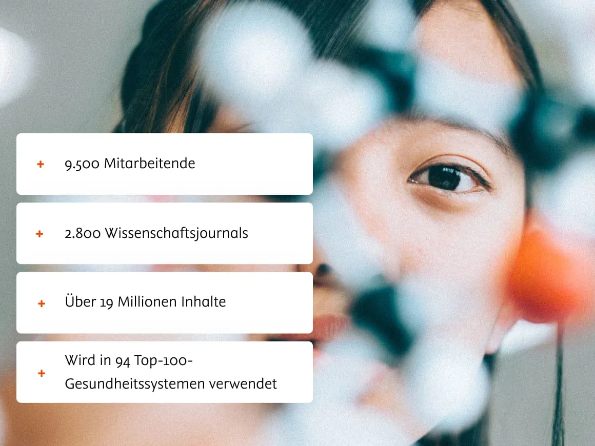 Doctor working with DNA model with overview of Elsevier employee, journal and health system data