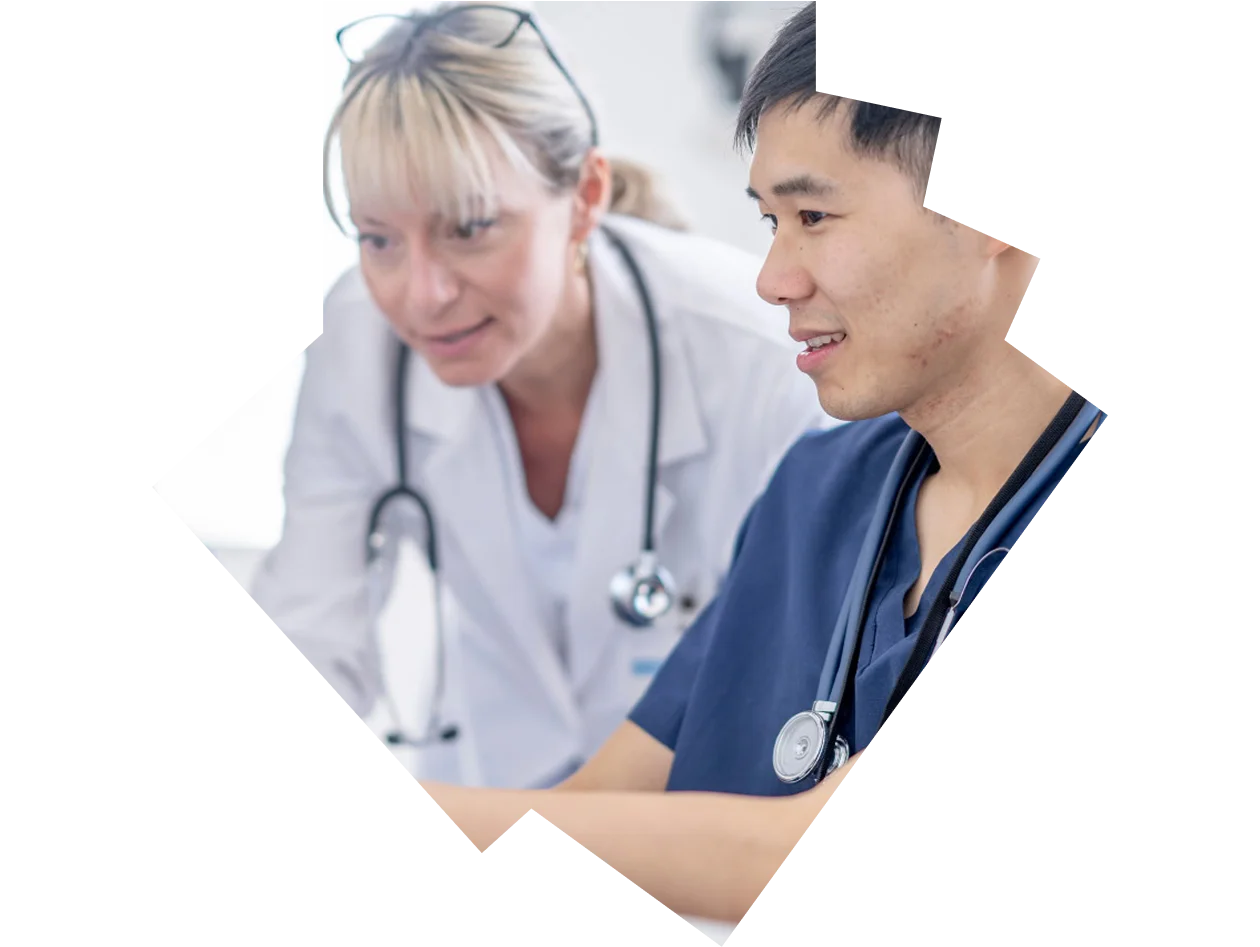 Medical professional teaching a student
