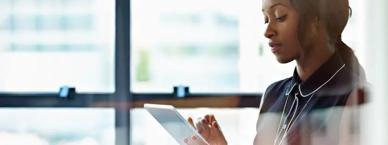 Businesswoman_using_a_digital_tablet_in_office