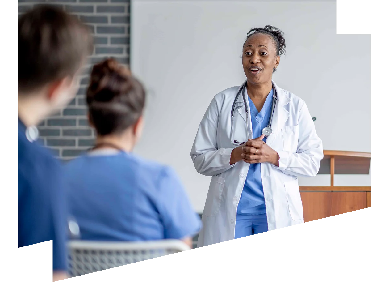 Medical lecturer standing in front of a class of students