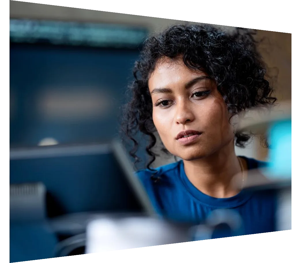 A female software engineer doing analysis work on laptop