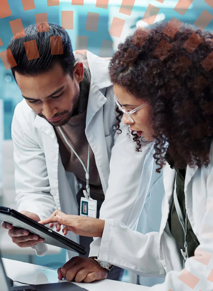Male and female scientist looking at tablet