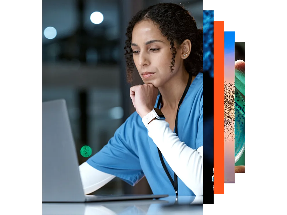 Smiling nurse and doctor looking at a laptop together