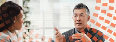 Manager talking to his colleagues in a meeting in the office