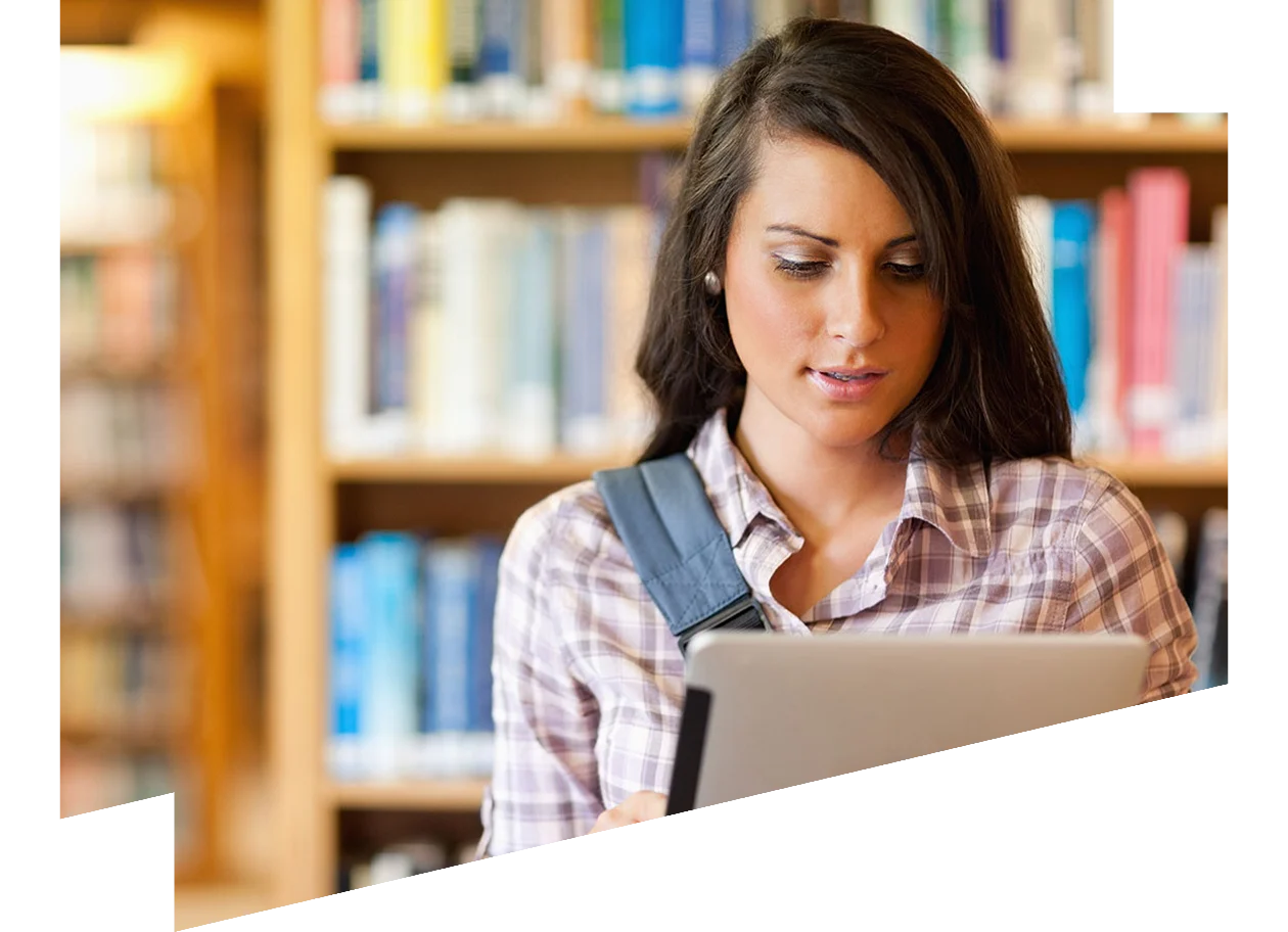 Young woman looking at a table in the library