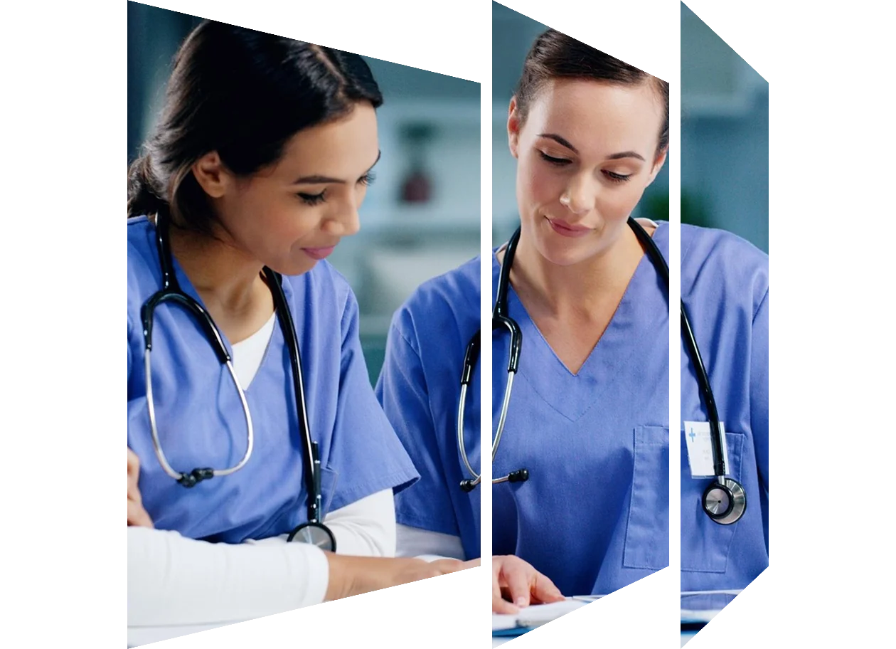 Two nurses having a discussion in a hospital