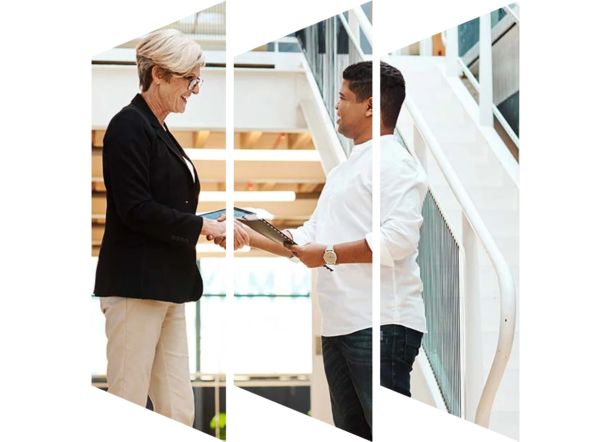 Businesswoman shaking hands with a young man