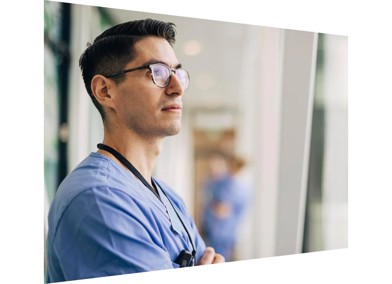 Close-up of young doctor looking ahead