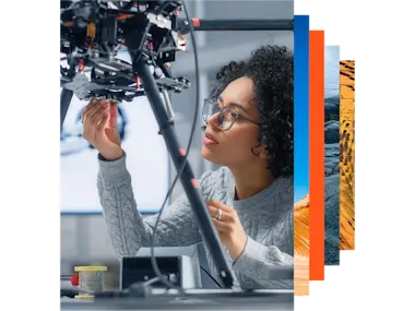 Concentrated female engineer developing software for a drone control in a research laboratory