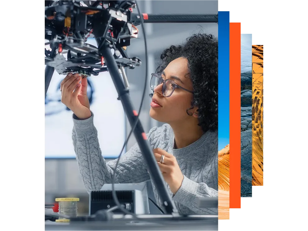 Concentrated female engineer developing software for a drone control in a research laboratory