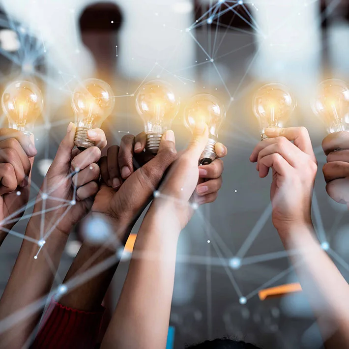 Hands holding lightbulbs