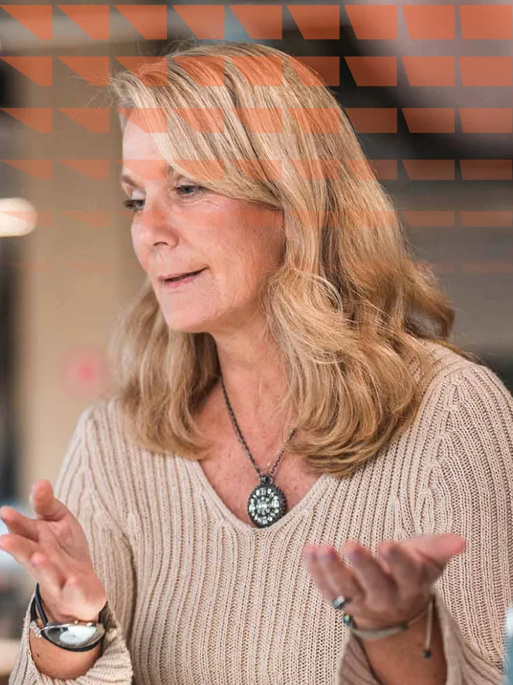 Mature woman explaining a topic to a colleague