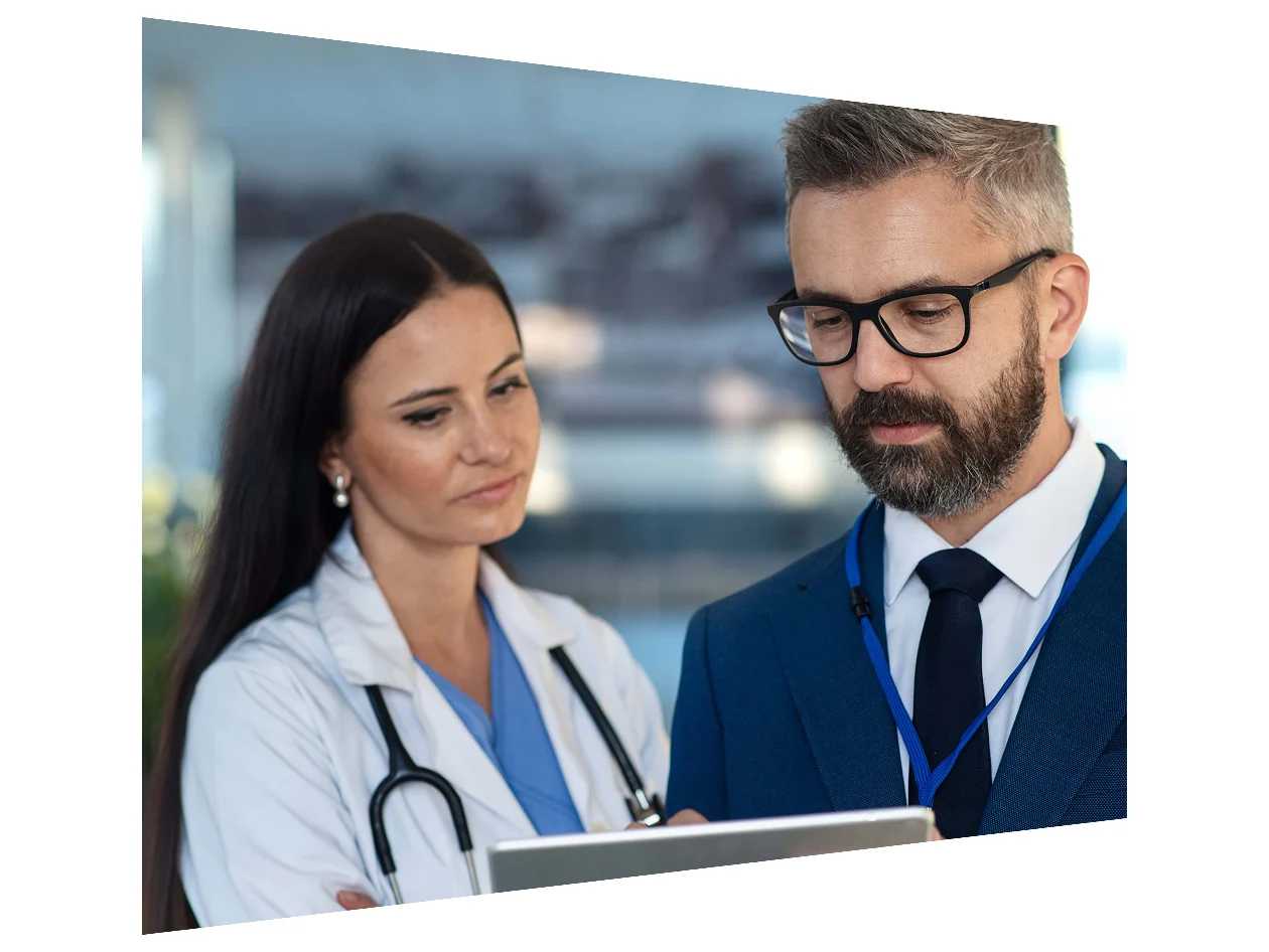 Businessman showing something in digital tablet to doctor.