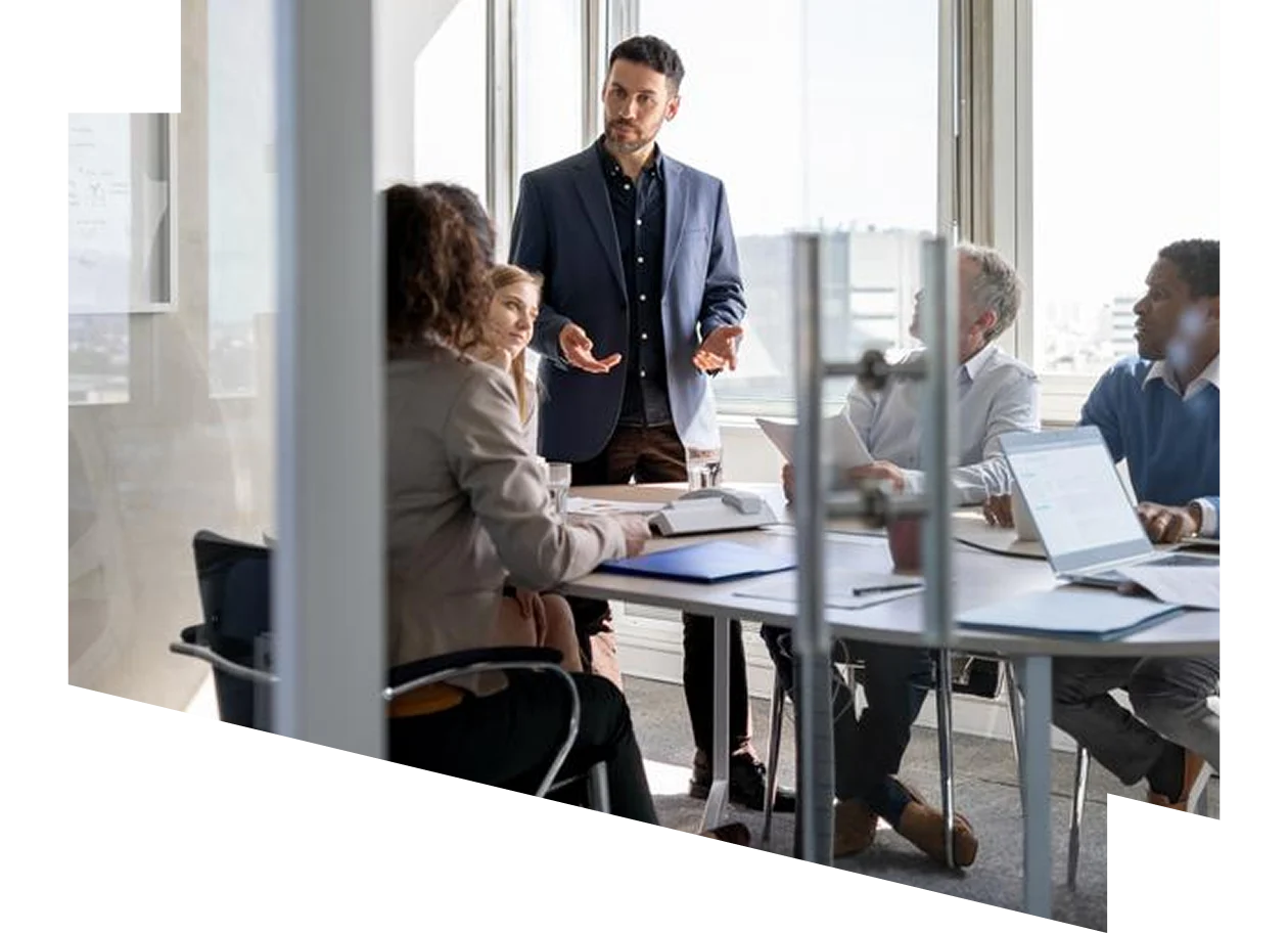 Businesswoman and business man reviewing paperwork together