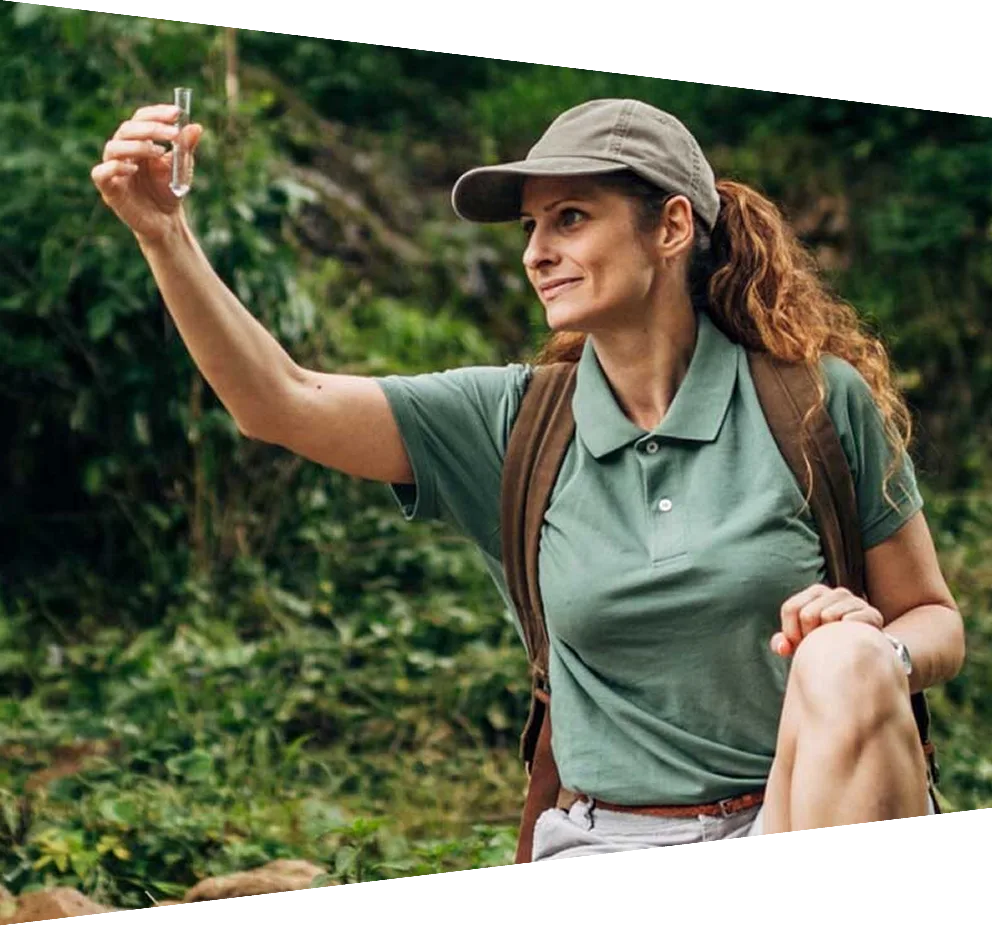 Female researcher taking a water sample
