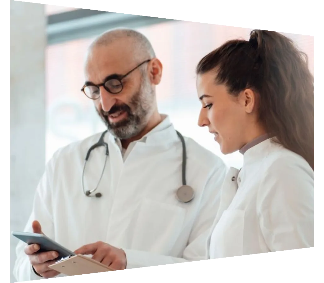 Two doctors looking at iphone