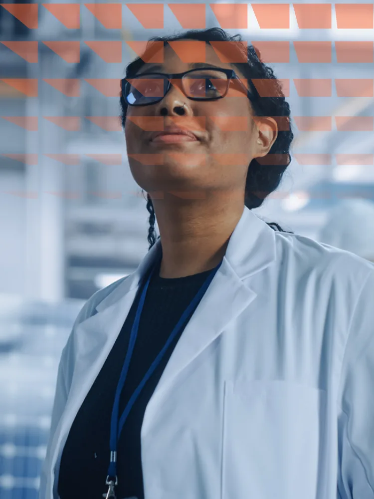 Female engineer looking around in wonder at the aerospace satellite manufacturing facility