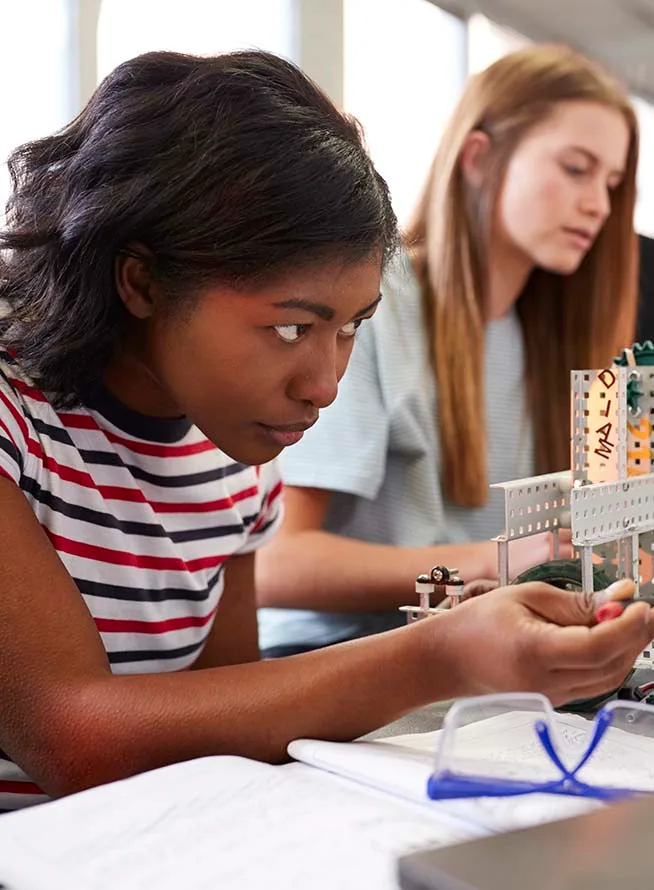 Engineering students working on project in classroom