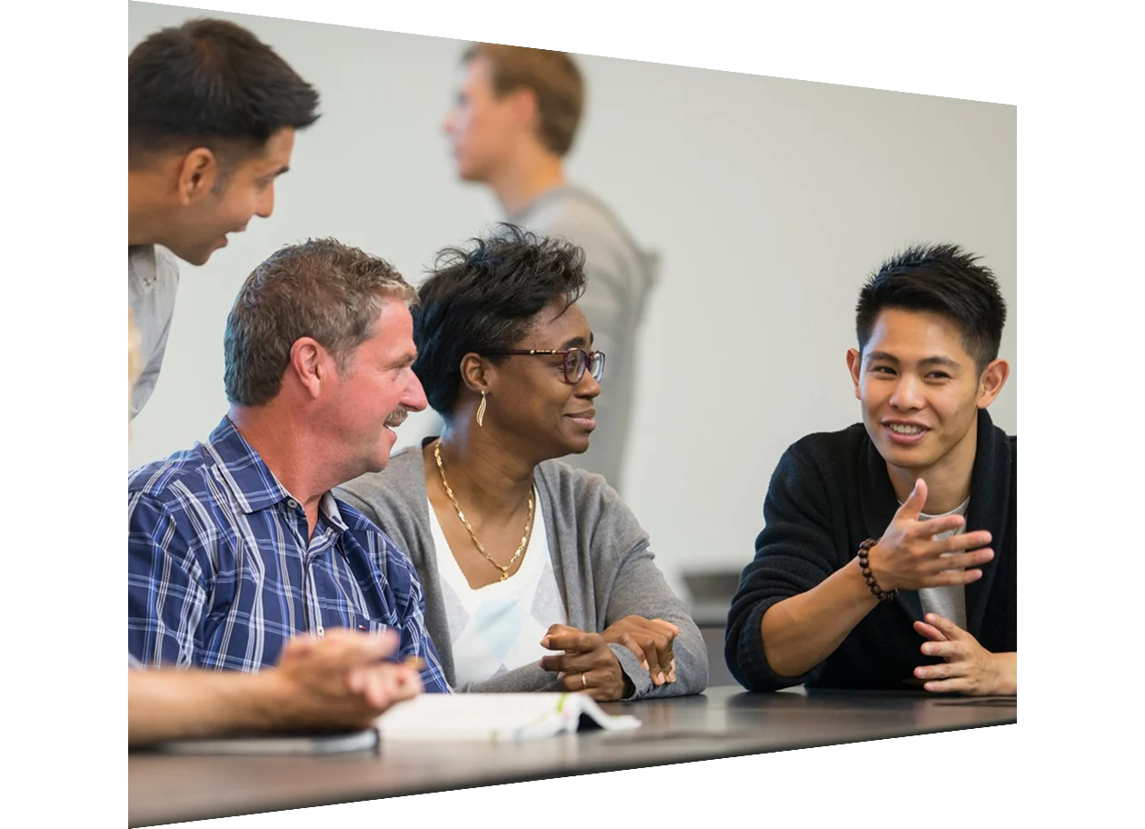Men and woman sitting in a university lecture hall