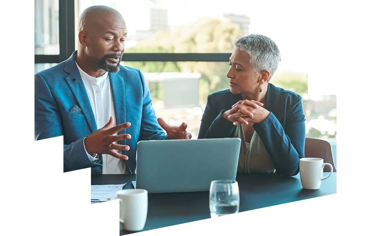 Businessman and woman working on a presentation in a corporate office