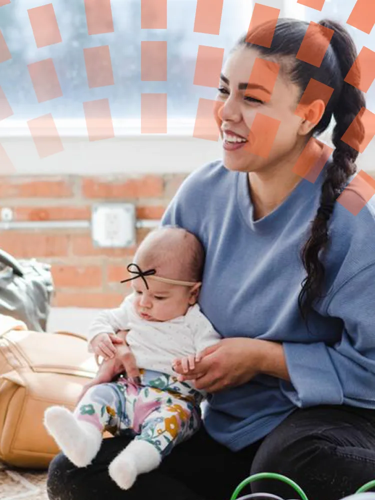 A father and daughter share a joyful laugh together.