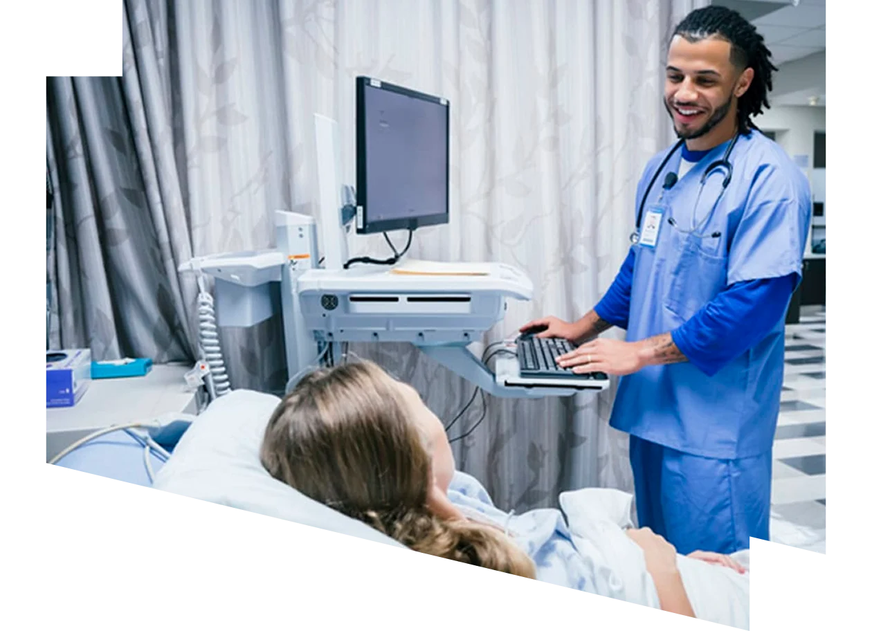 Male nurse reviewing education content with a female patient in hospital
