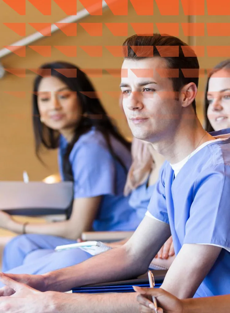 A multi-ethnic group of students sitting in a university lecture hall