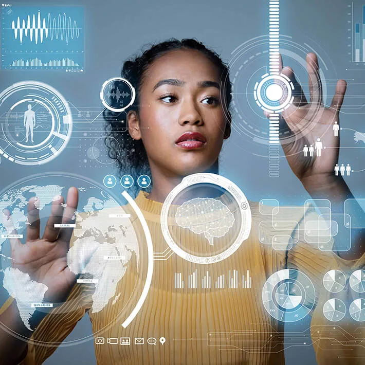 Woman standing in front of graphical user interface