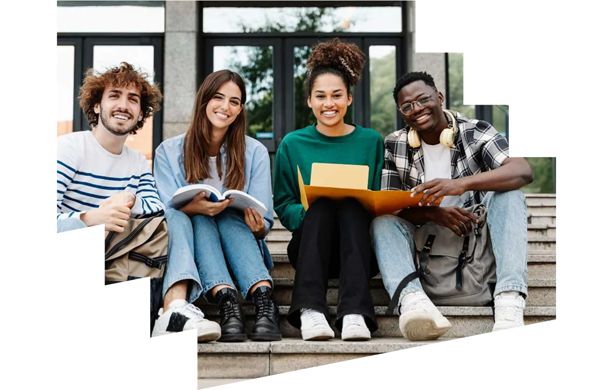 Group of students sitting on steps outside their university
