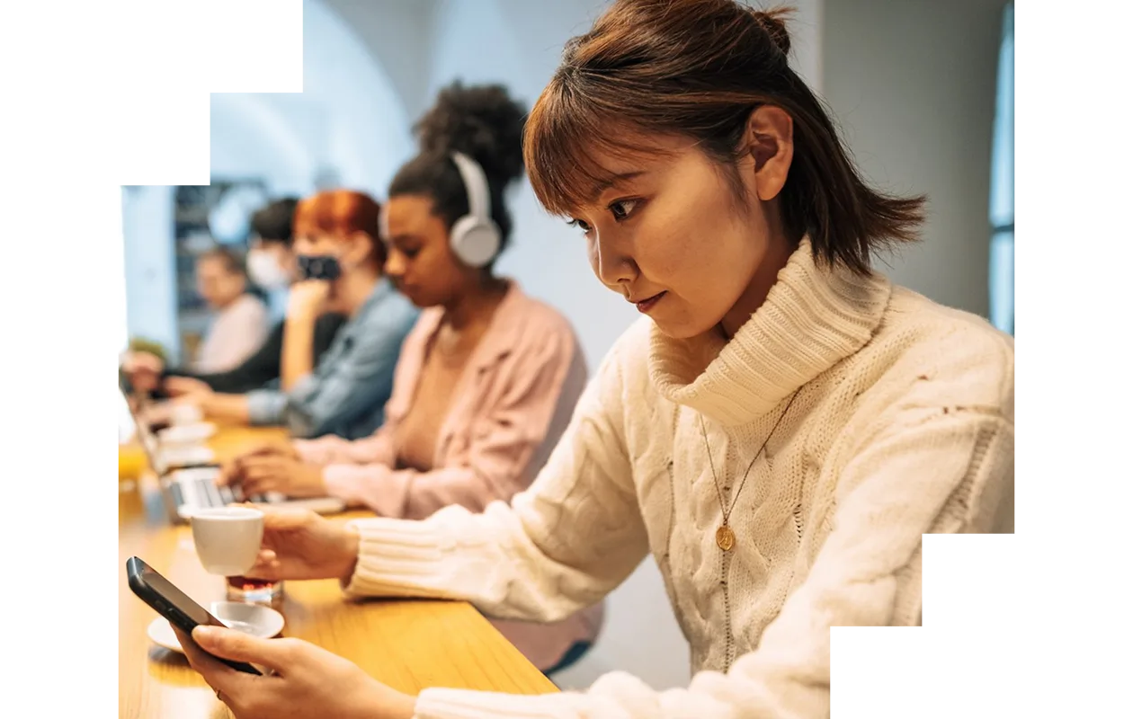 Young man working on his laptop in a library 
