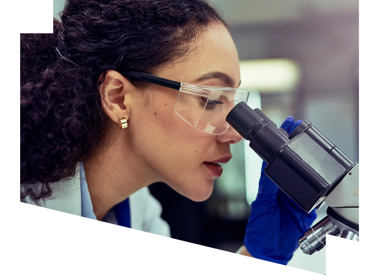 Close up of a scientist using a microscope in a laboratory