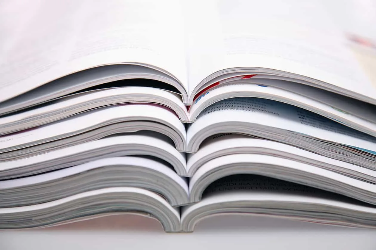 stack of open journals