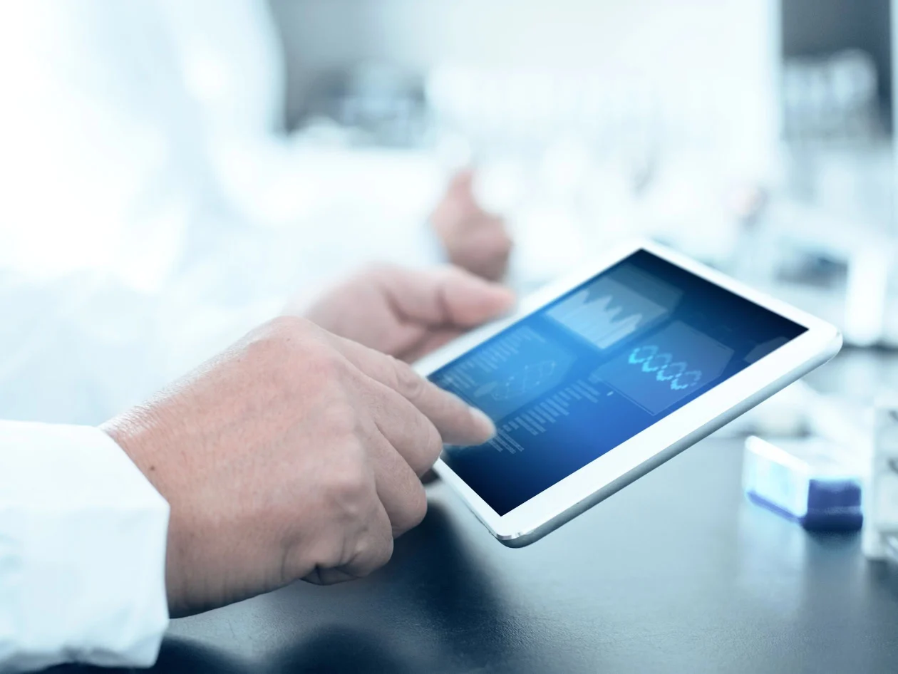 Chemist using a tablet